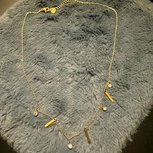Elegant Gold Necklace with Charms